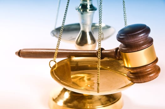 Wooden justice gavel and block with brass