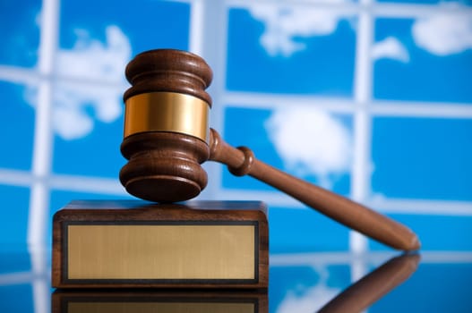 Wooden justice gavel and block with brass