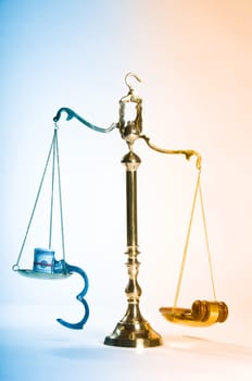 Wooden justice gavel and block with brass
