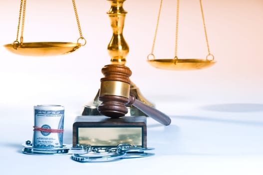 Wooden justice gavel and block with brass