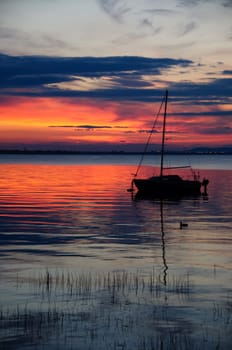 watching a sunset on the calm water