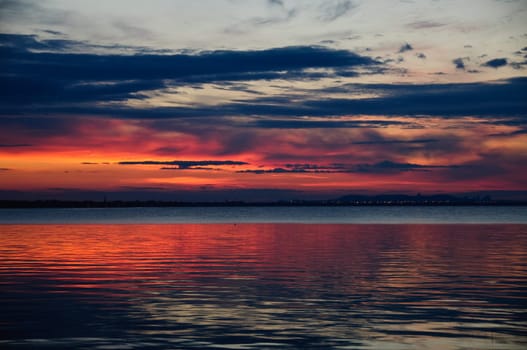 watching a sunset on the calm water