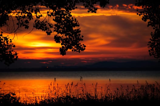 watching a sunset on the calm water