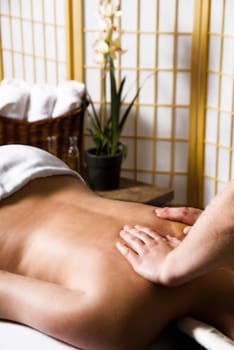 woman getting a good massage at a day spa