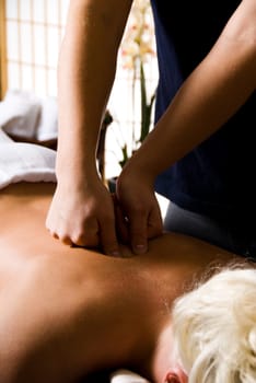 woman getting a good massage at a day spa