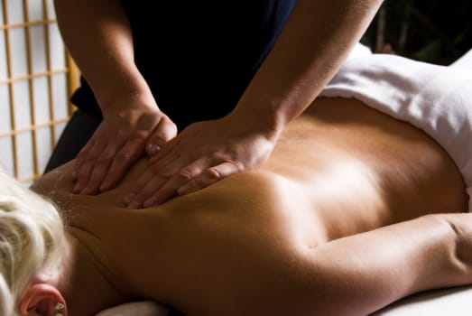 woman getting a good massage at a day spa