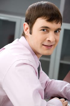 Portrait of confident smiling manager looking at camera