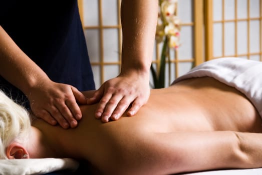 woman getting a good massage at a day spa