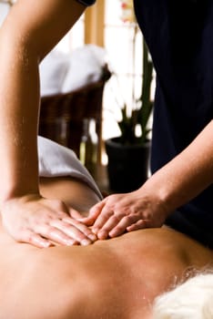 woman getting a good massage at a day spa