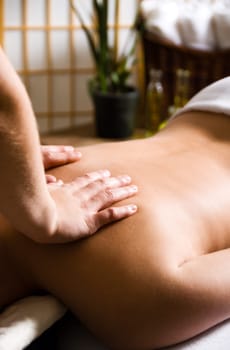 woman getting a good massage at a day spa