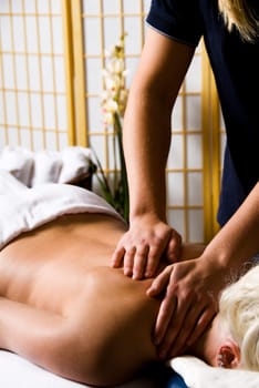 woman getting a good massage at a day spa