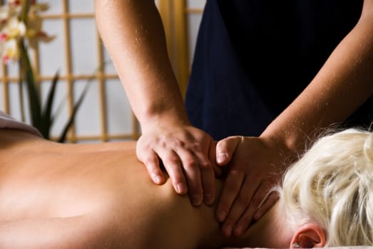 woman getting a good massage at a day spa