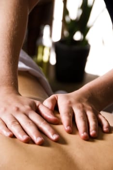 woman getting a good massage at a day spa