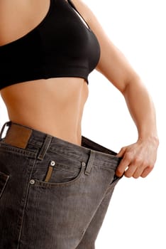 female wearing old jeans who has lost weight