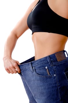 female wearing old jeans who has lost weight
