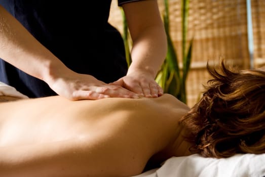 woman in a day spa getting a good massage