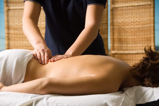 woman in a day spa getting a good massage