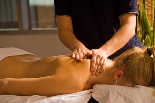 woman at a day spa getting a massage