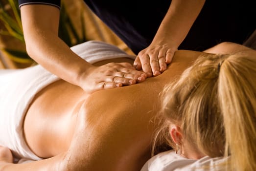 woman at a day spa getting a back massage
