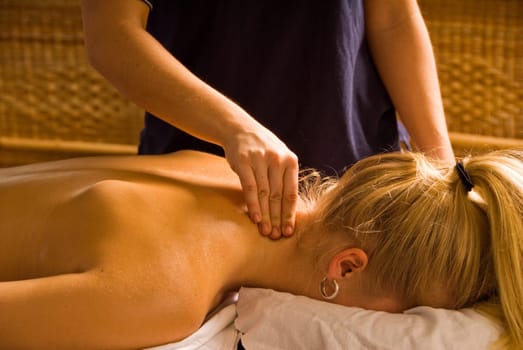 woman at a day spa getting a nice neck massage
