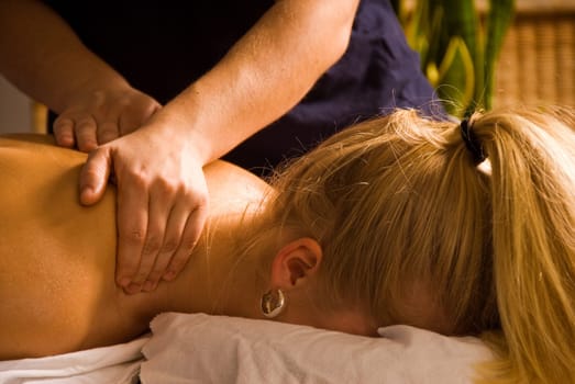 woman at a day spa getting a neck rub