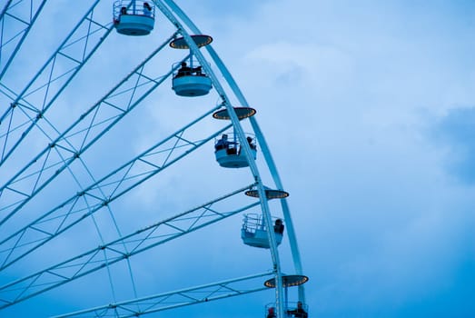 a ferris wheel in Paris in a blue tint