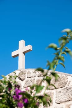Greek church in santorini greece with a cross