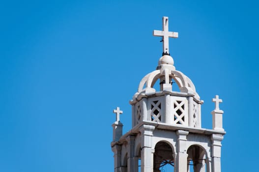 Greek church in santorini greece with a cross