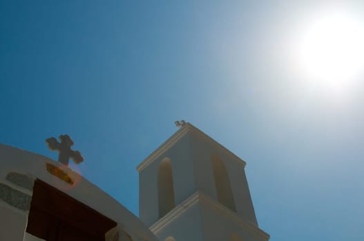 Greek church in santorini greece with a cross