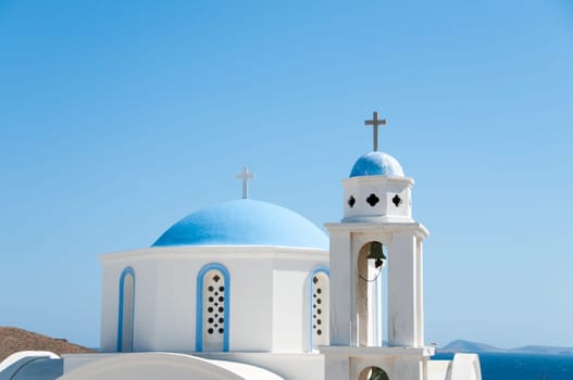 Greek church in santorini greece with a cross