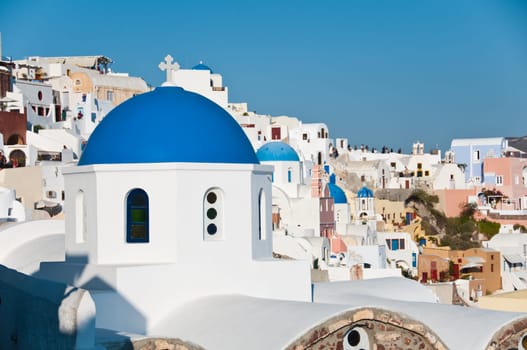 Greek church in santorini greece with a cross