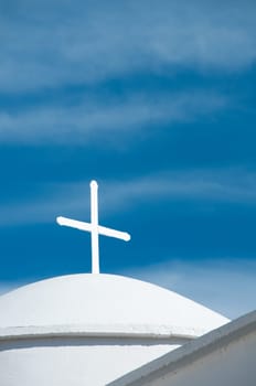 Greek church in santorini greece with a cross