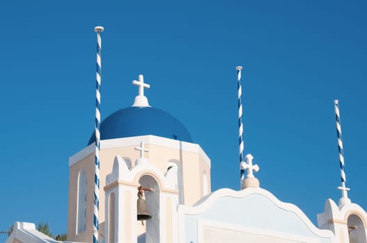 Greek church in santorini greece with a cross