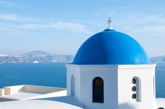 Greek church in santorini greece with a cross