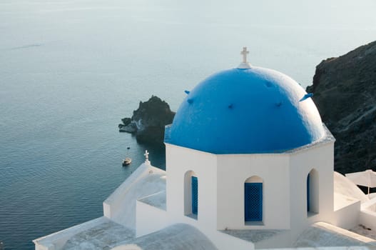 Greek church in santorini greece with a cross