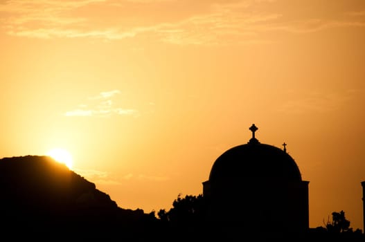 Greek church in santorini greece with a cross