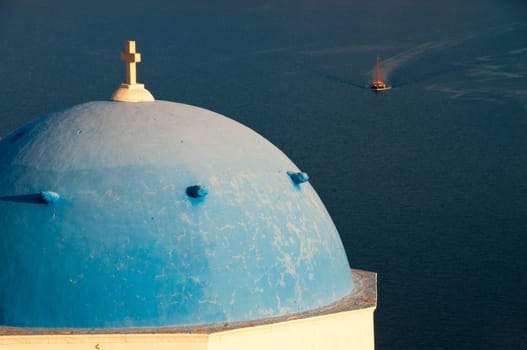 Greek church in santorini greece with a cross
