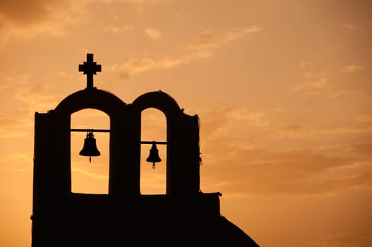 Greek church in santorini greece with a cross