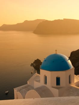 Greek church in santorini greece with a cross