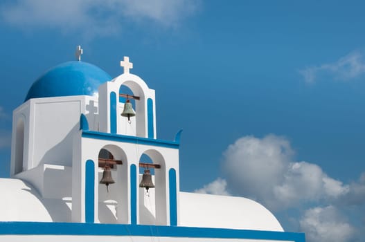 Greek church in santorini greece with a cross