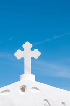 Greek church in santorini greece with a cross