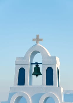 Greek church in santorini greece with a cross