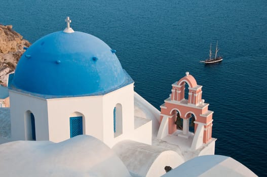 Greek church in santorini greece with a cross