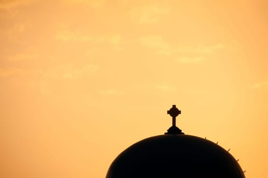Greek church in santorini greece with a cross