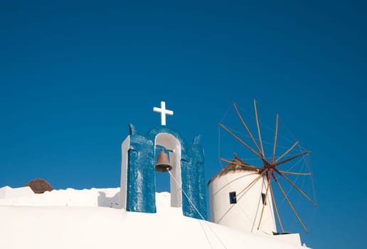 Greek church in santorini greece with a cross