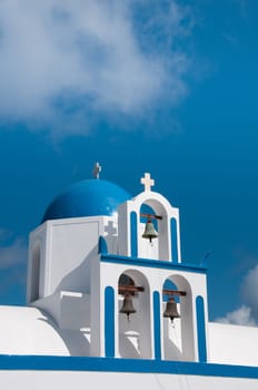 Greek church in santorini greece with a cross