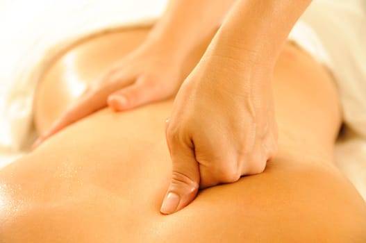 Beautiful woman in a spa with massage therapy