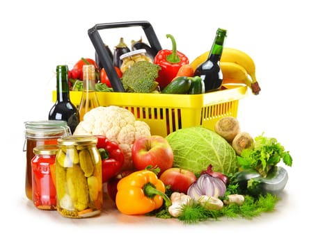 Composition with plastic shopping basket and grocery isolated on white