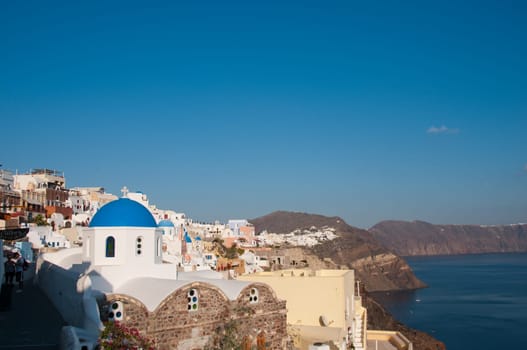 Greek church in santorini greece with a cross