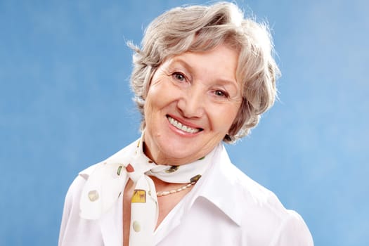 Portrait of stylish woman grey haired looking at camera